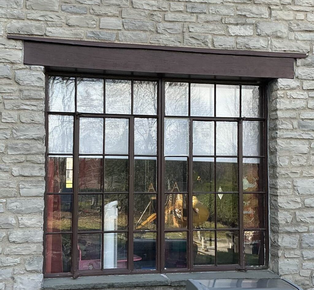 Outdated, drafty, original windows before New York Sash upgraded this home.