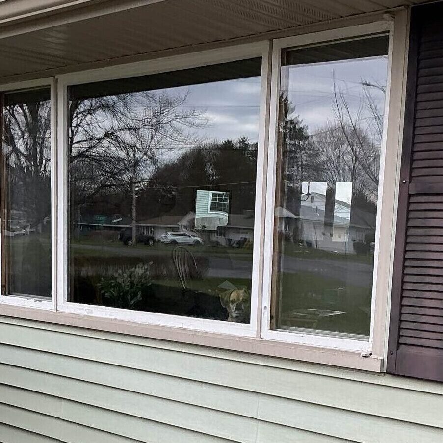 Exterior look of an old wooden window, about to be replaced by a custom-made replacement vinyl window from New York Sash.