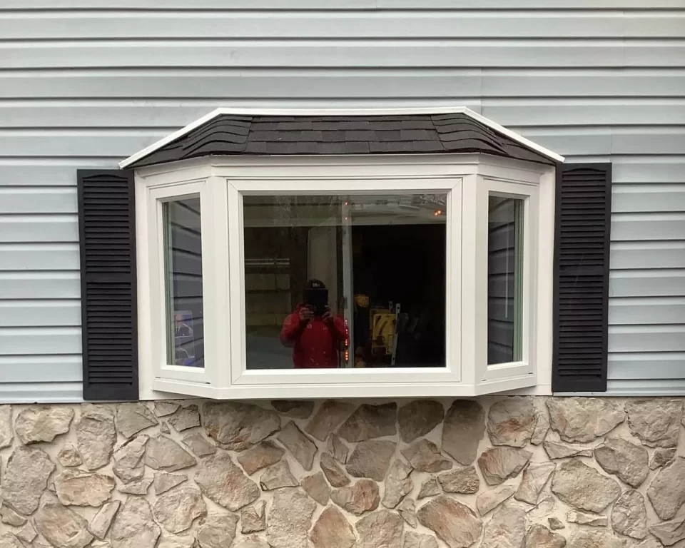 New bay window with casements on each end, all finished in white.