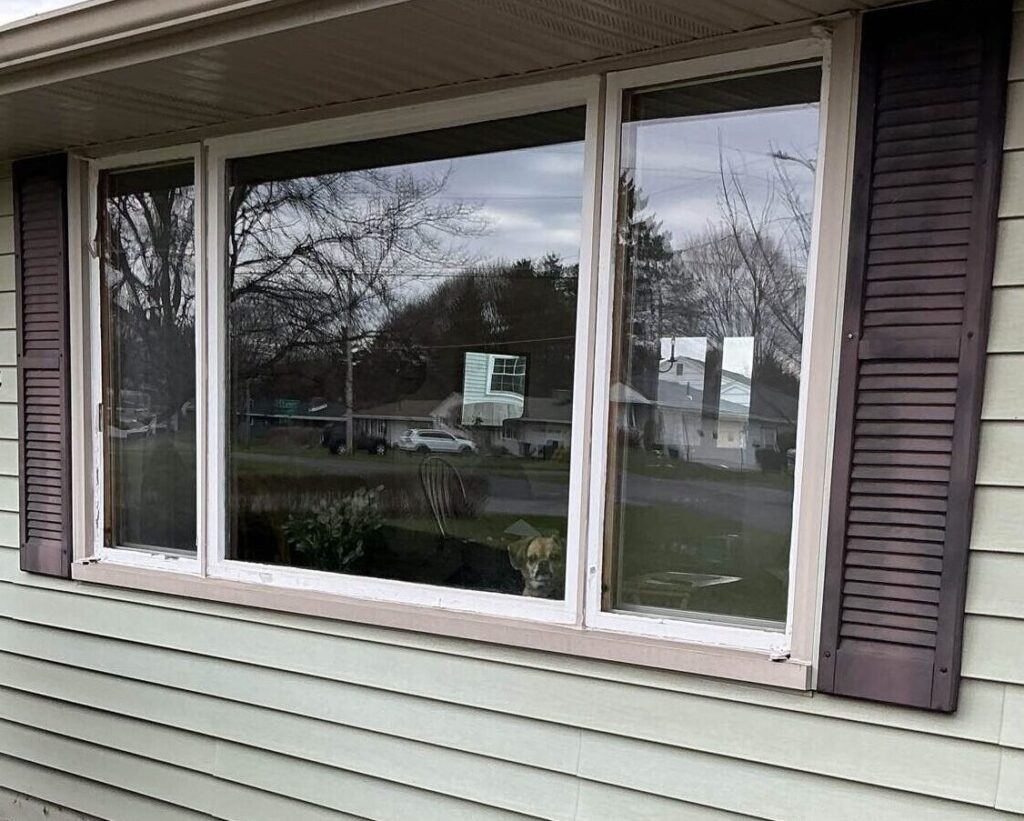 Exterior look of an old wooden window, about to be replaced by a custom-made replacement vinyl window from New York Sash.