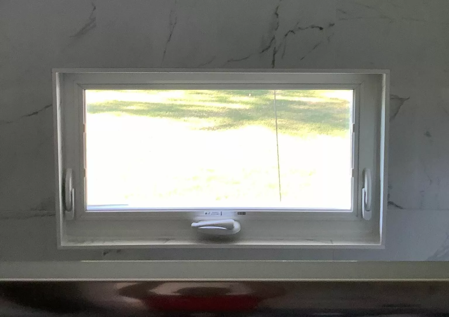 new white awning window in bathroom